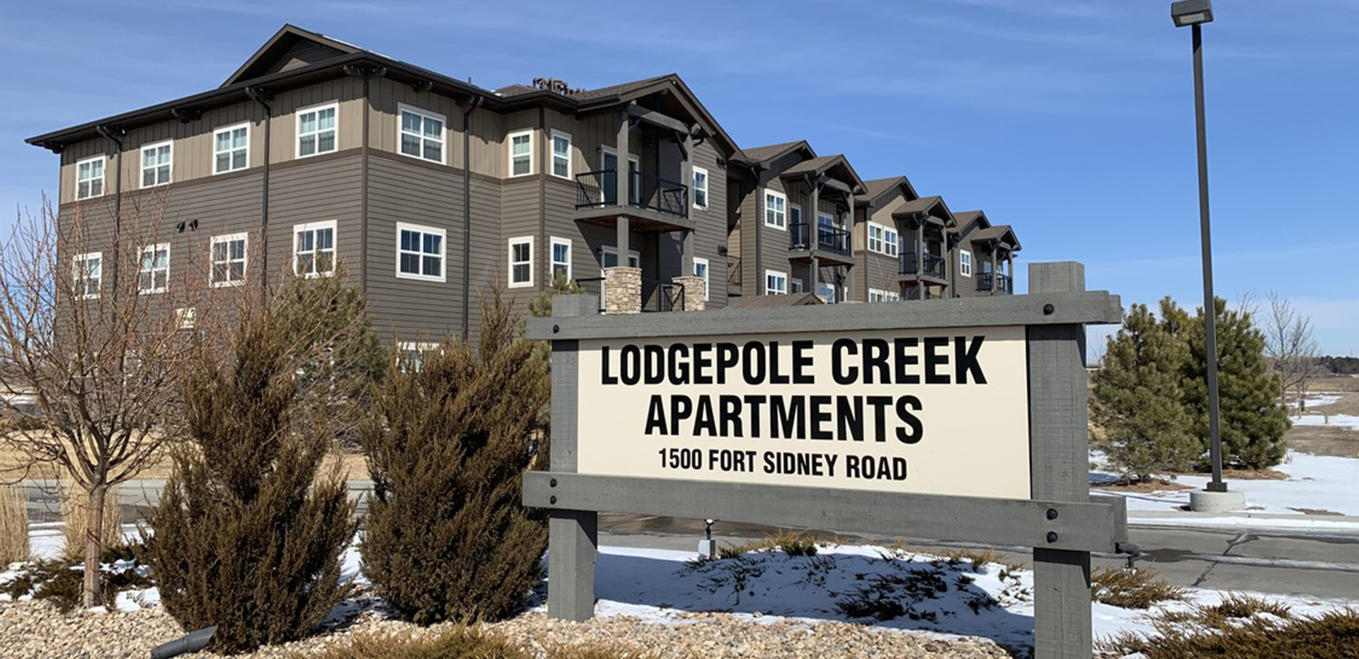 Lodgepole Creek Apartments entrance sign.